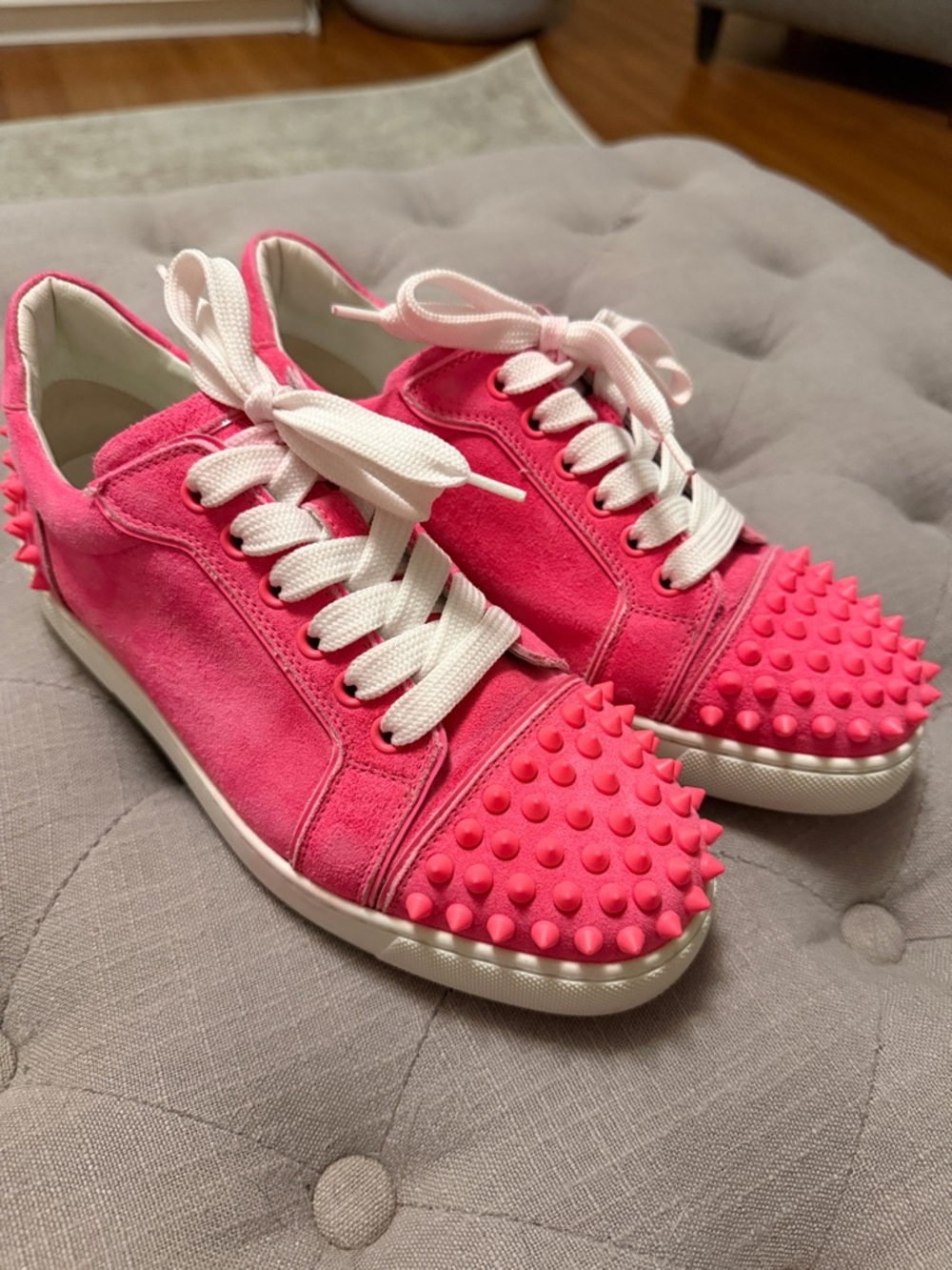 Christian Louboutin neon pink studded sneaker